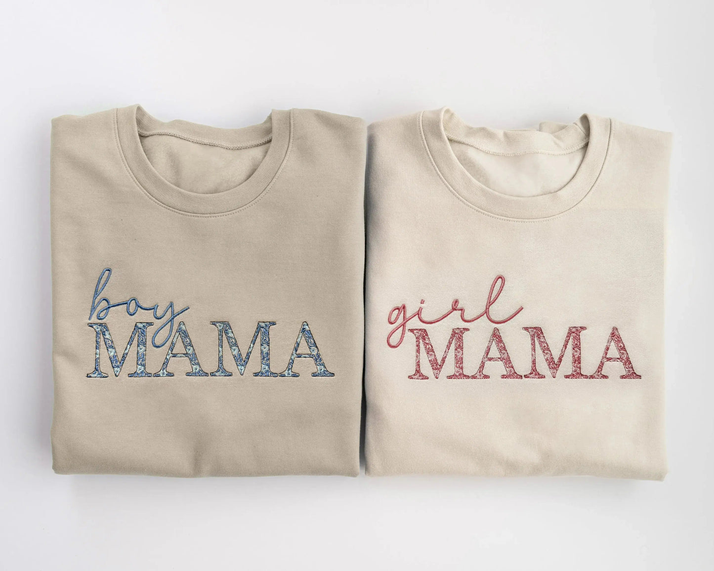 girl mama embroidered sweatshirt with pink floral embroidery gift for new mom folded next to boy mama sweatshirt