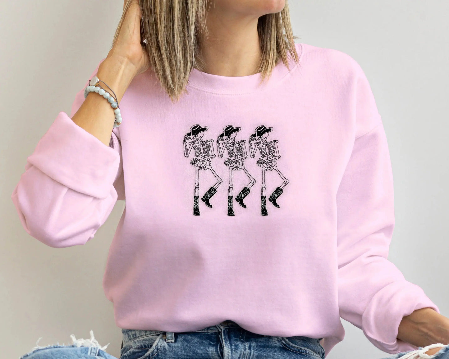 embroidered cowboy skeleton funny halloween sweatshirt halloween crewneck in pink