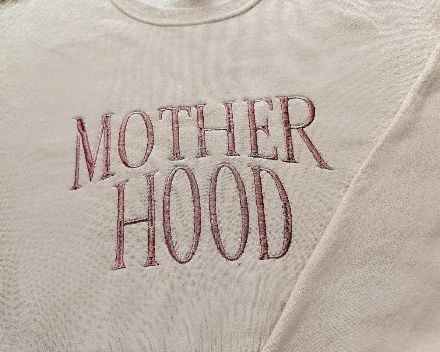 motherhood embroidered mother sweatshirt new mom gift in neutral beige with amber thread