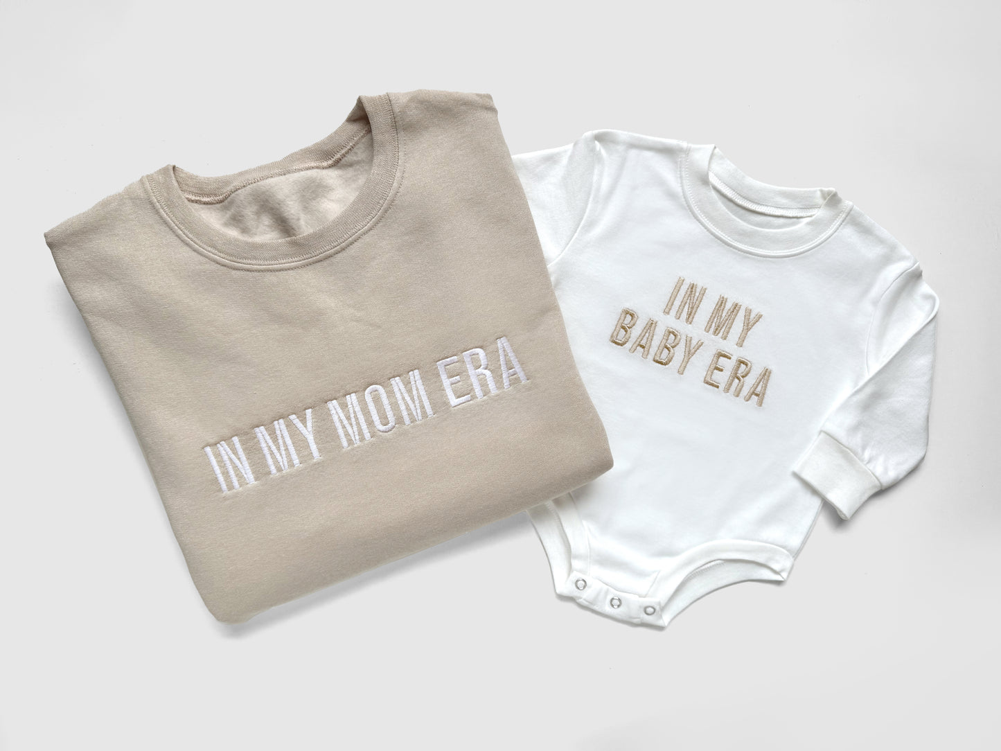 taylor swift in my mom era in my baby era matching baby onesies and sweatshirts crewneck pullover hoodie neutral beige white embroidered embroidery newborn baby shower gift new mom mommy and me mama and mini family matching outfits