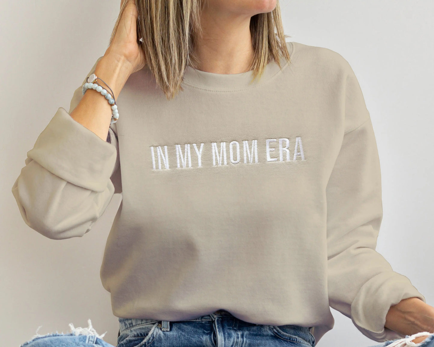 taylor swift in my mom era in my baby era matching baby onesies and sweatshirts crewneck pullover hoodie neutral beige white embroidered embroidery newborn baby shower gift new mom mommy and me mama and mini family matching outfits