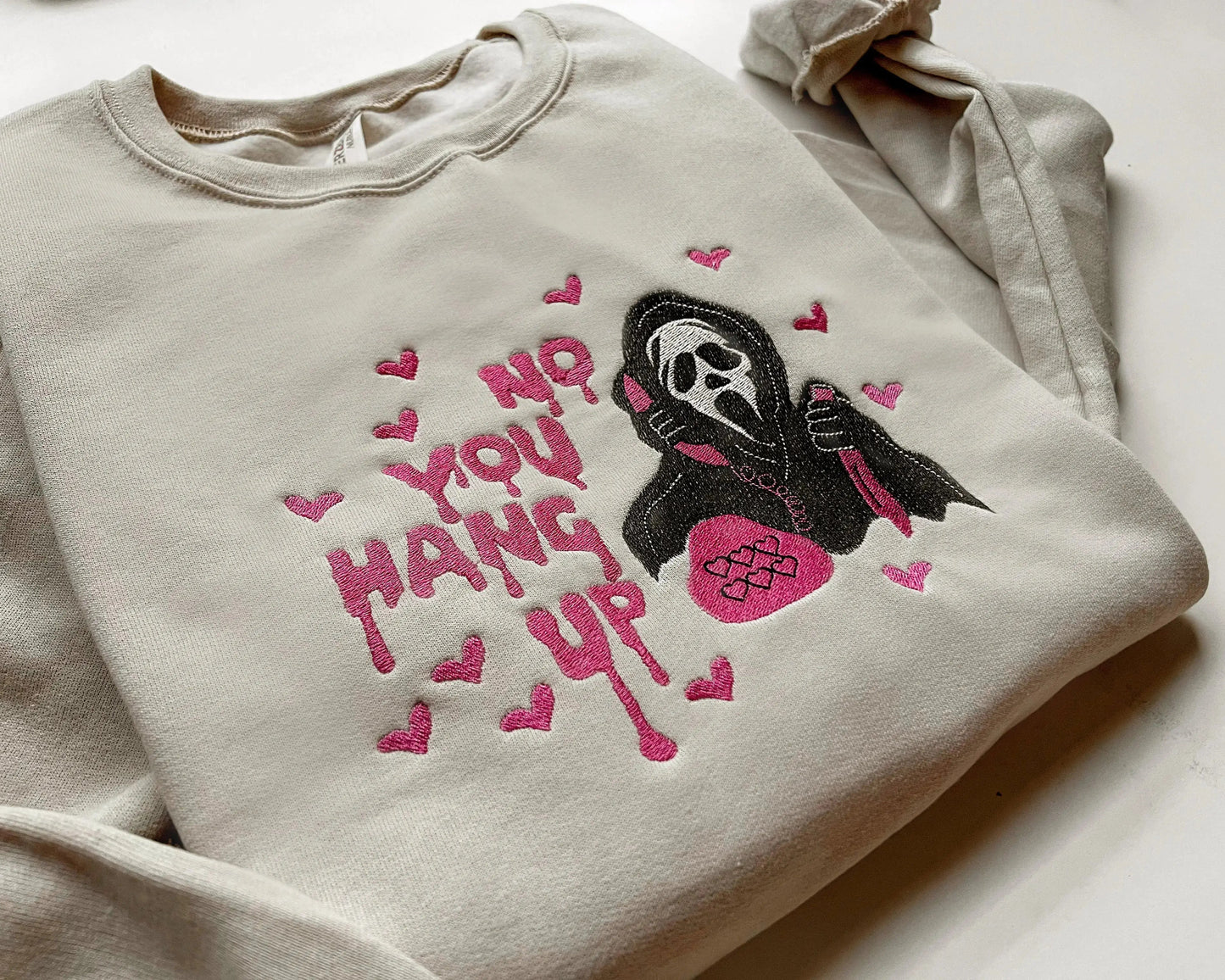ghostface scream halloween sweatshirt in sand folded