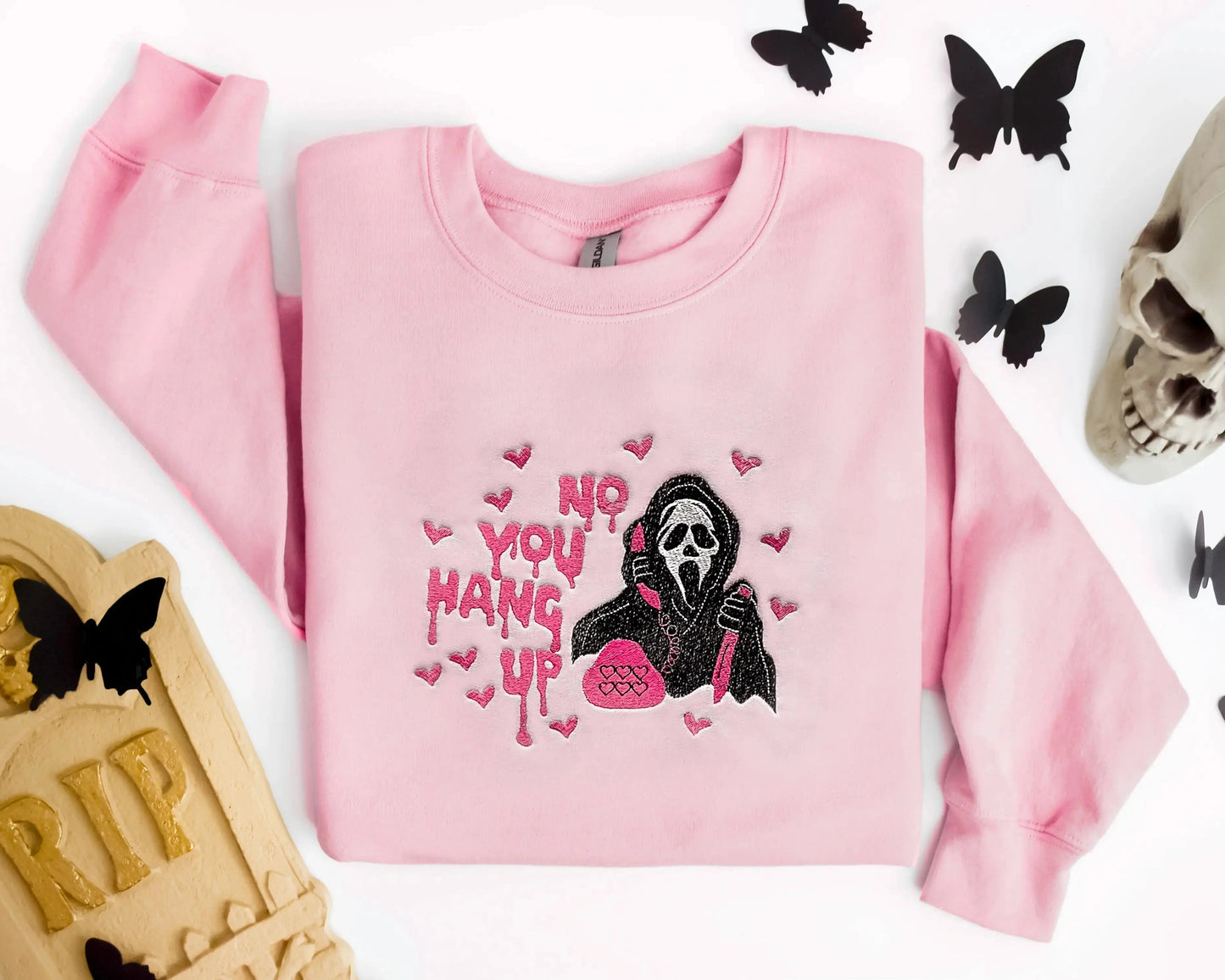 ghostface scream halloween sweatshirt in pink folded