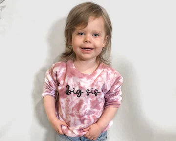 Spring Vibes: Pastel tees with “Big Sis / Little Sis” prints.