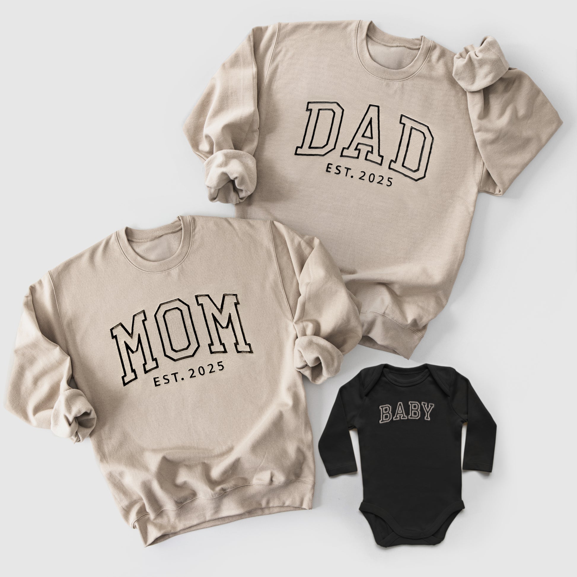 beige and black neutral matching mom, dad and baby sweatshirts and onesies