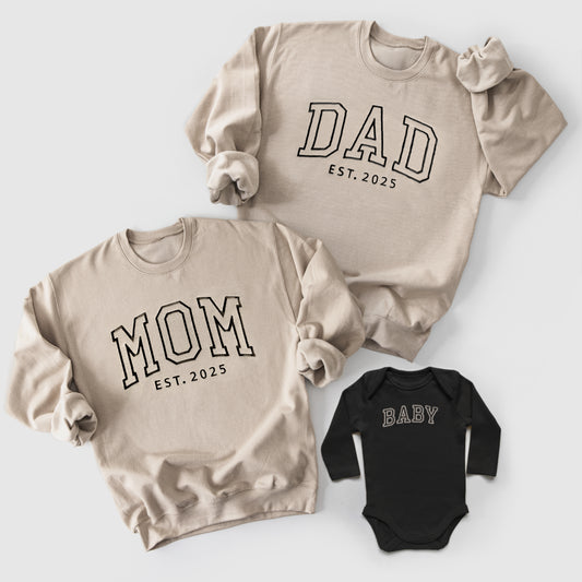 beige and black neutral matching mom, dad and baby sweatshirts and onesies