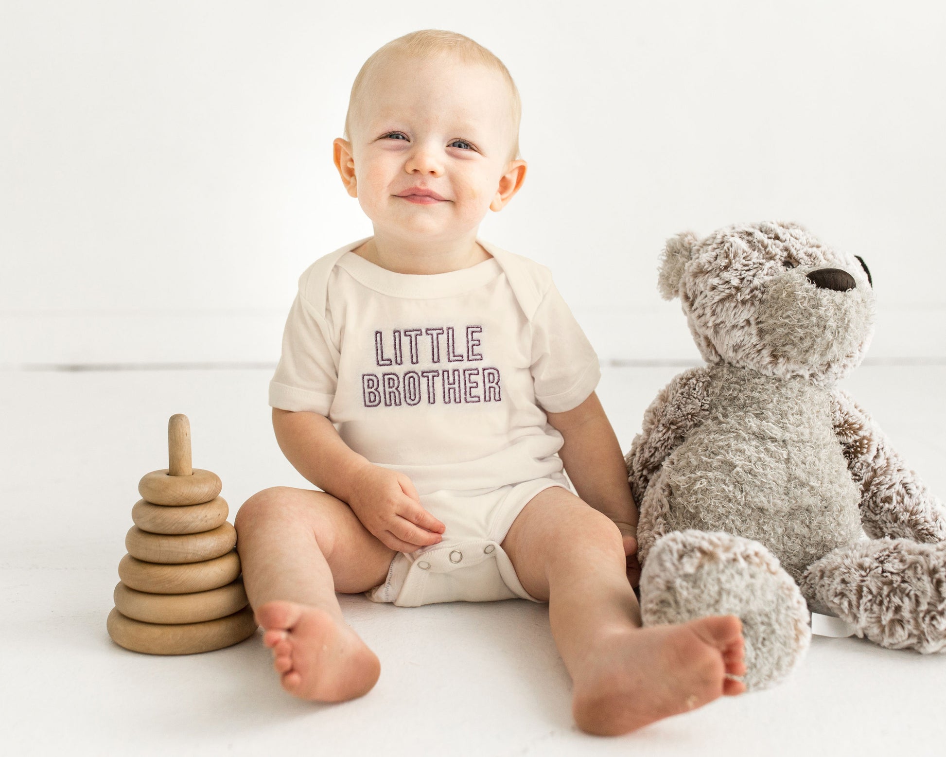 Celebrate sibling love with these adorable cream embroidered sibling shirts and bodysuits, perfect for family photos, pregnancy announcements, and everyday wear! Each piece is made from soft, high-quality cotton and comes in your choice of baby bodysuit, baby bubble romper, toddler t-shirt, or youth t-shirt.