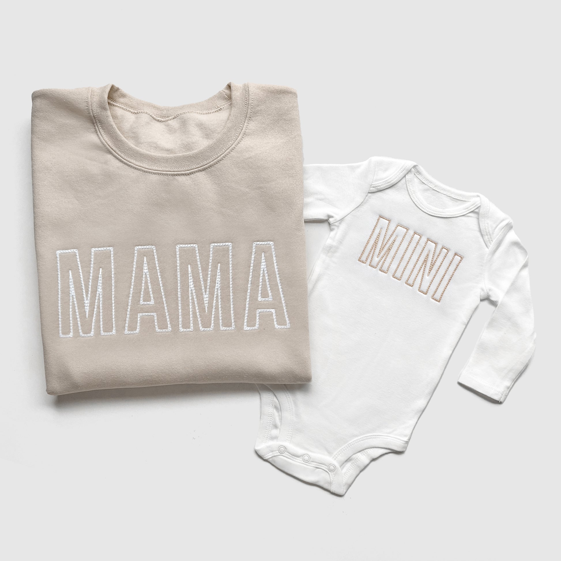 Embroidered mommy and me matching sweatshirts and baby bodysuit in modern neutral colors