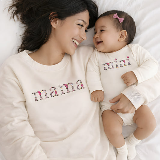 Cream floral mother daughter matching set with embroidered mama sweatshirt and baby bodysuit, a timeless outfit for newborn photos and thoughtful new mom gifts.