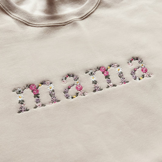 Close up of floral embroidery on mama and mini matching outfits