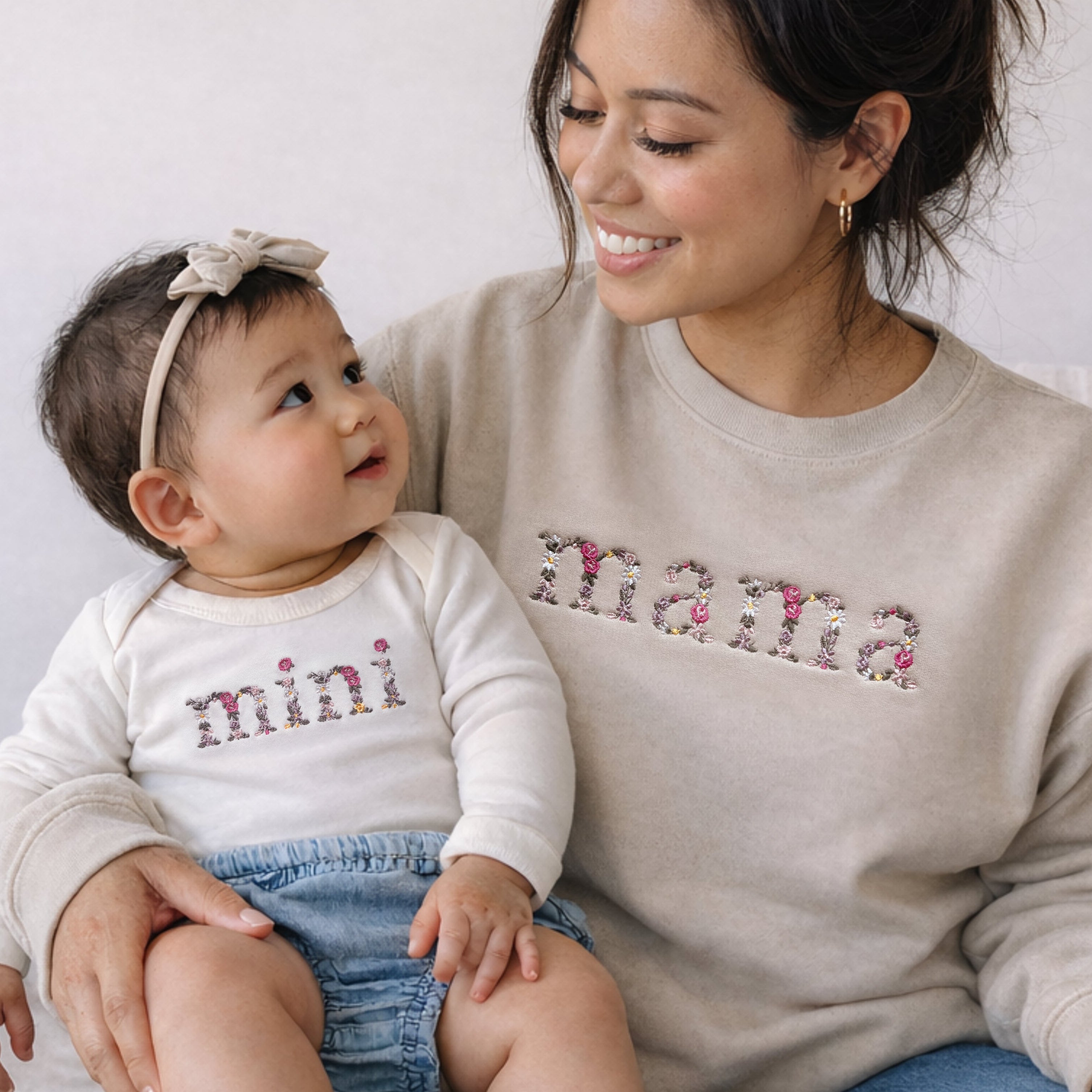 Floral mama and mini matching outfits with embroidered mama sweatshirt and baby bodysuit in neutral tones