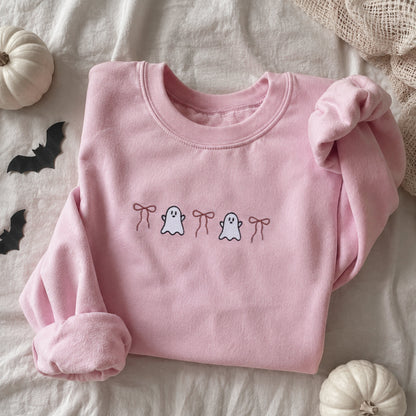 Pink embroidered ghost and bow Halloween sweatshirt on light pink fleece crewneck