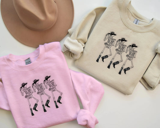 embroidered cowboy skeleton funny halloween sweatshirt halloween crewneck in pink and sand
