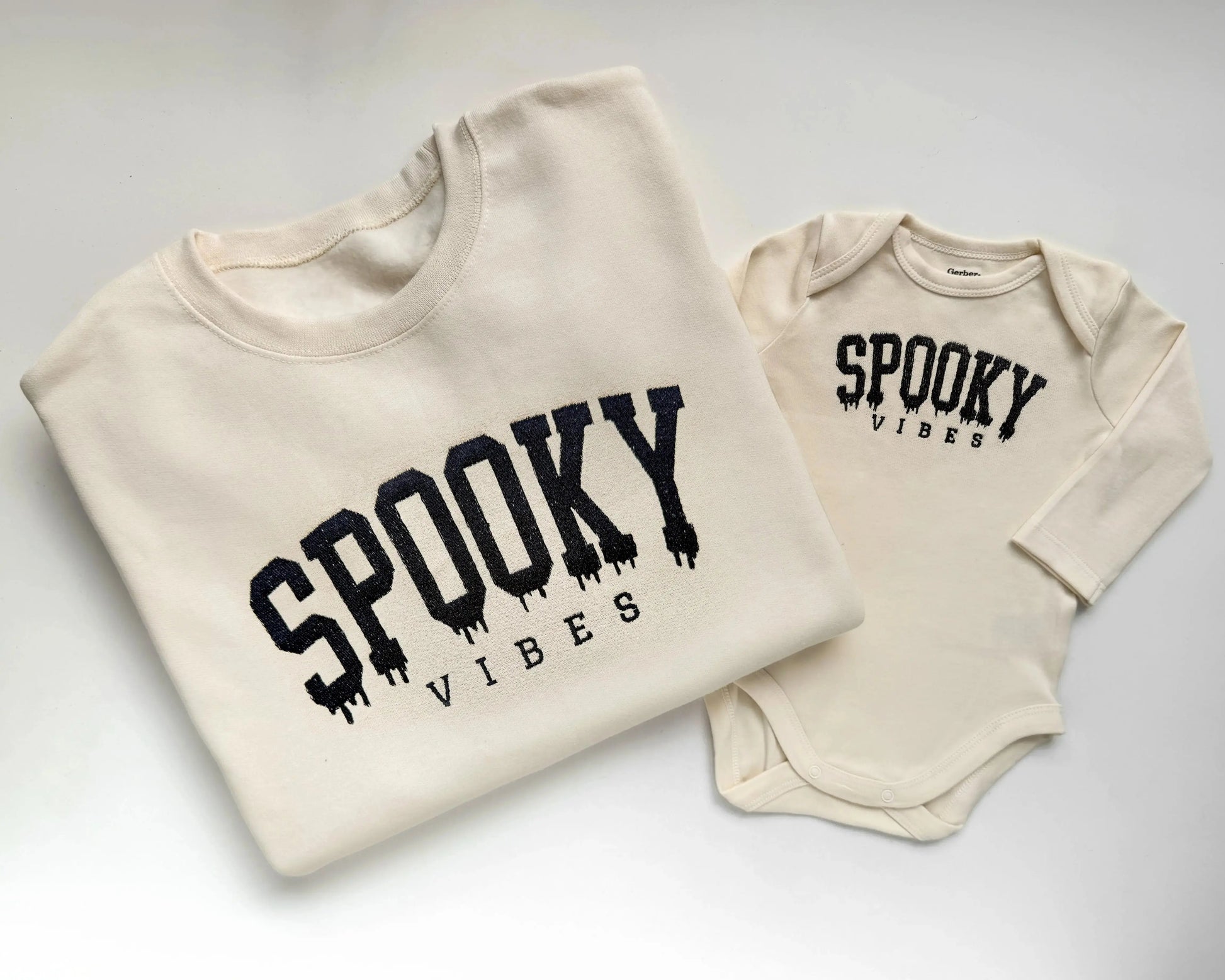 spooky vibes embroidered halloween sweatshirts for mom and baby in cream folded