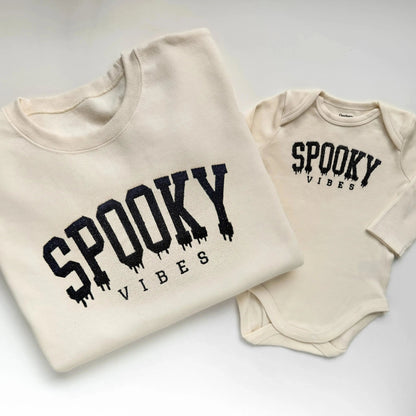 spooky vibes embroidered halloween sweatshirts for mom and baby in cream folded
