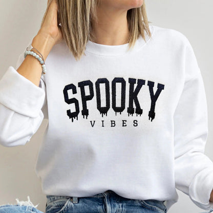 spooky vibes embroidered halloween sweatshirts for mom and baby in white on model