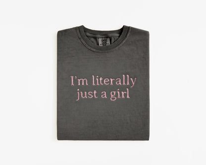 Folded dark gray t-shirt with pink text on a white background