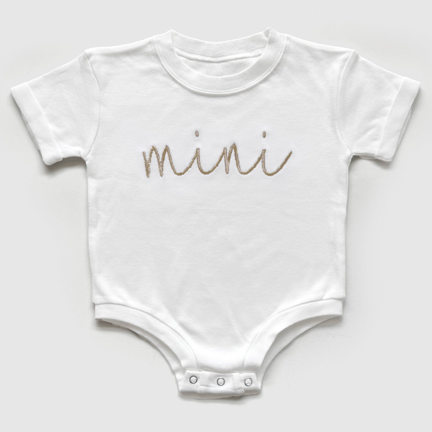 mama and mini neutral matching embroidered t-shirt mom and baby set flat lay of a bubble romper