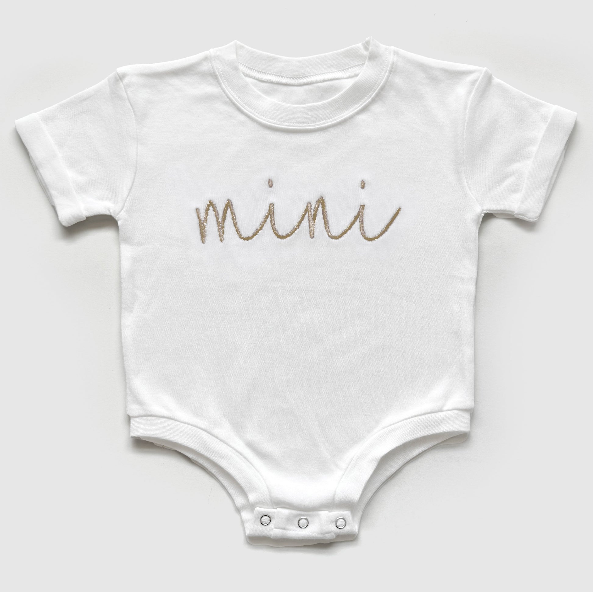 mama and mini neutral matching embroidered t-shirt mom and baby set flat lay of a bubble romper