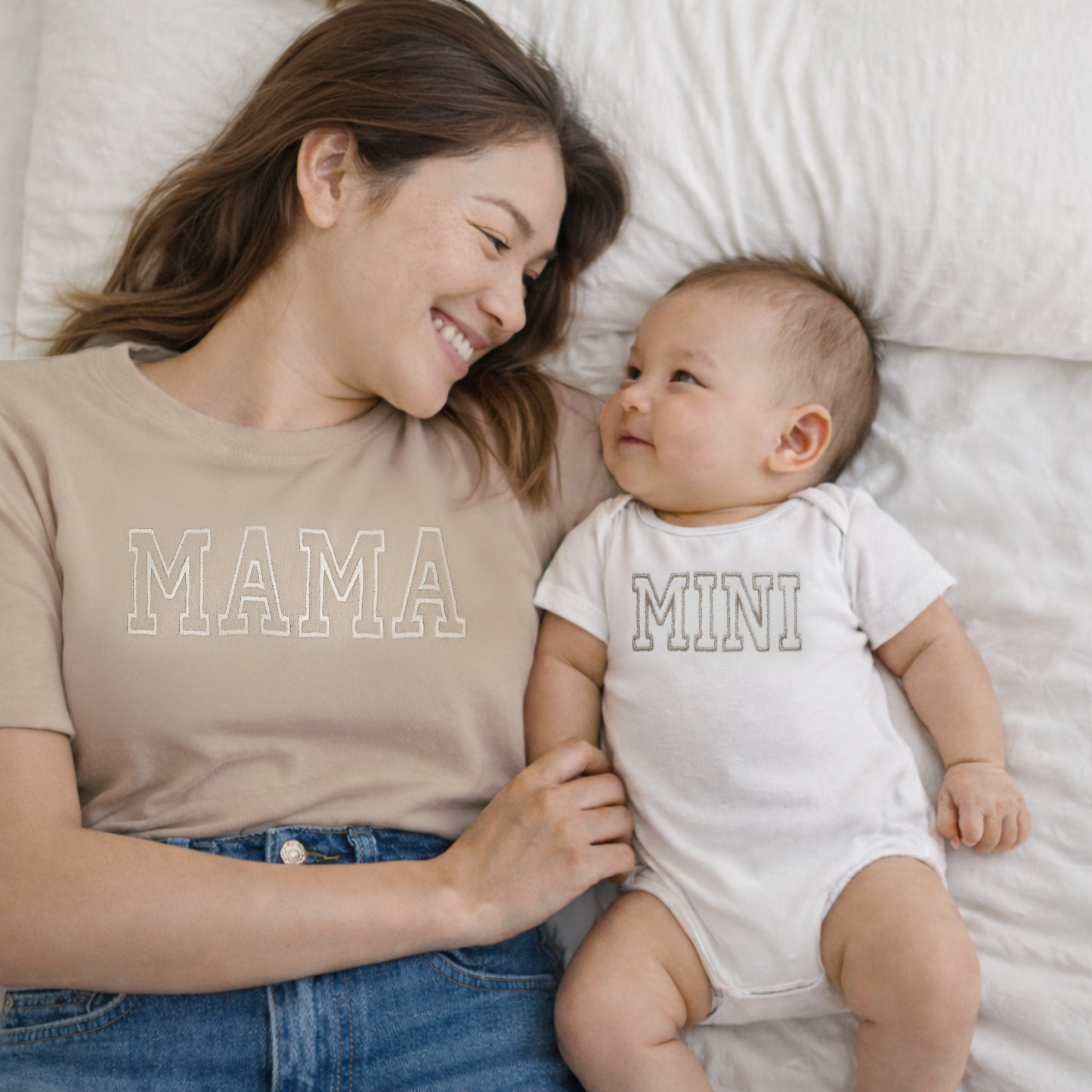 mama and mini neutral matching embroidered t-shirt mom and baby set lifestyle shot on a mom and son with varsity font 
