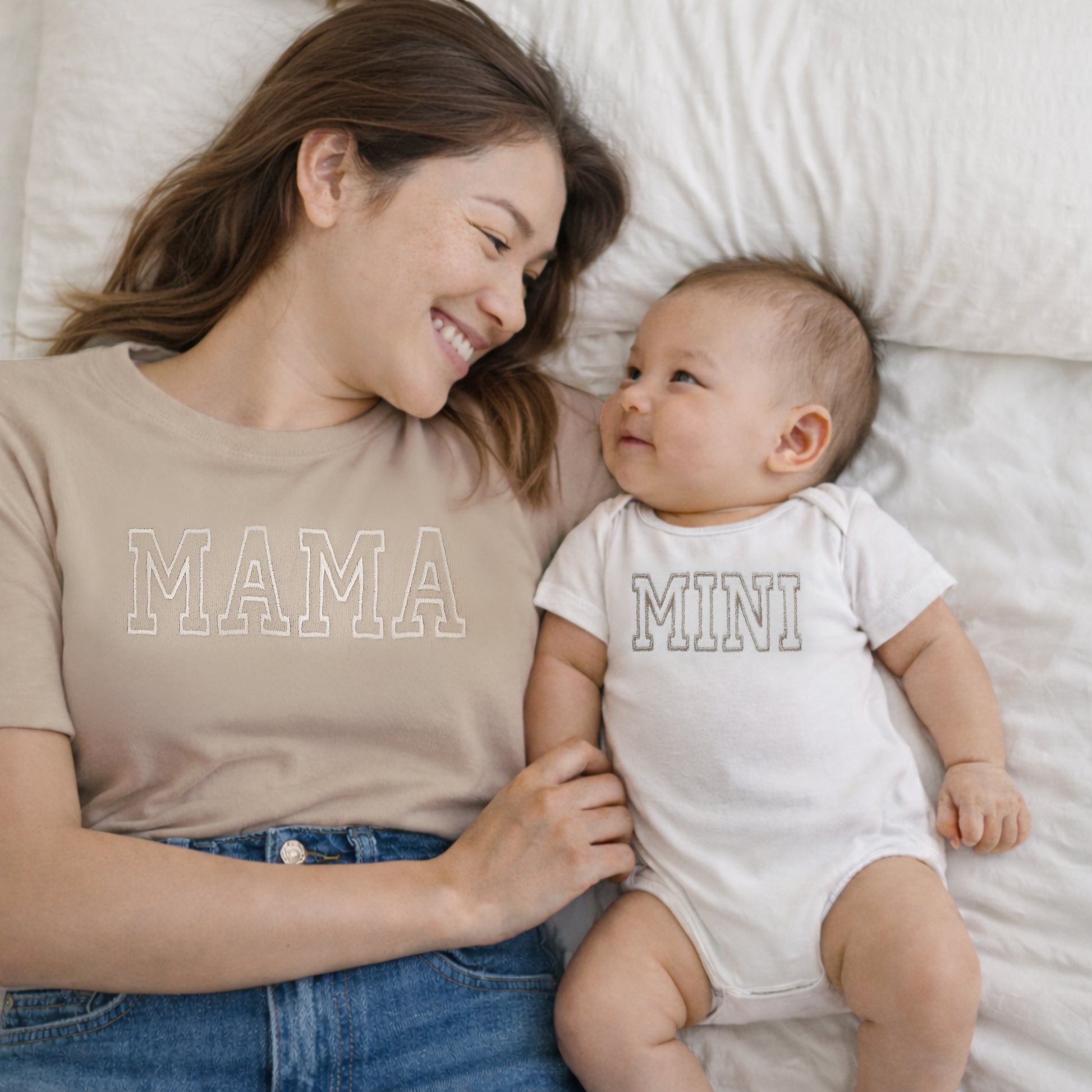 mama and mini neutral matching embroidered t-shirt mom and baby set lifestyle shot on a mom and son with varsity font 