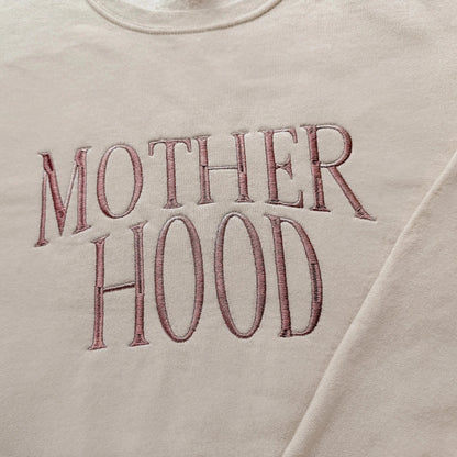 motherhood embroidered mother sweatshirt new mom gift in neutral beige with amber thread