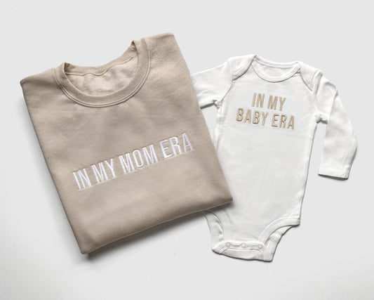 taylor swift in my mom era in my baby era matching baby onesies and sweatshirts crewneck pullover hoodie neutral beige white embroidered embroidery newborn baby shower gift new mom mommy and me mama and mini family matching outfits