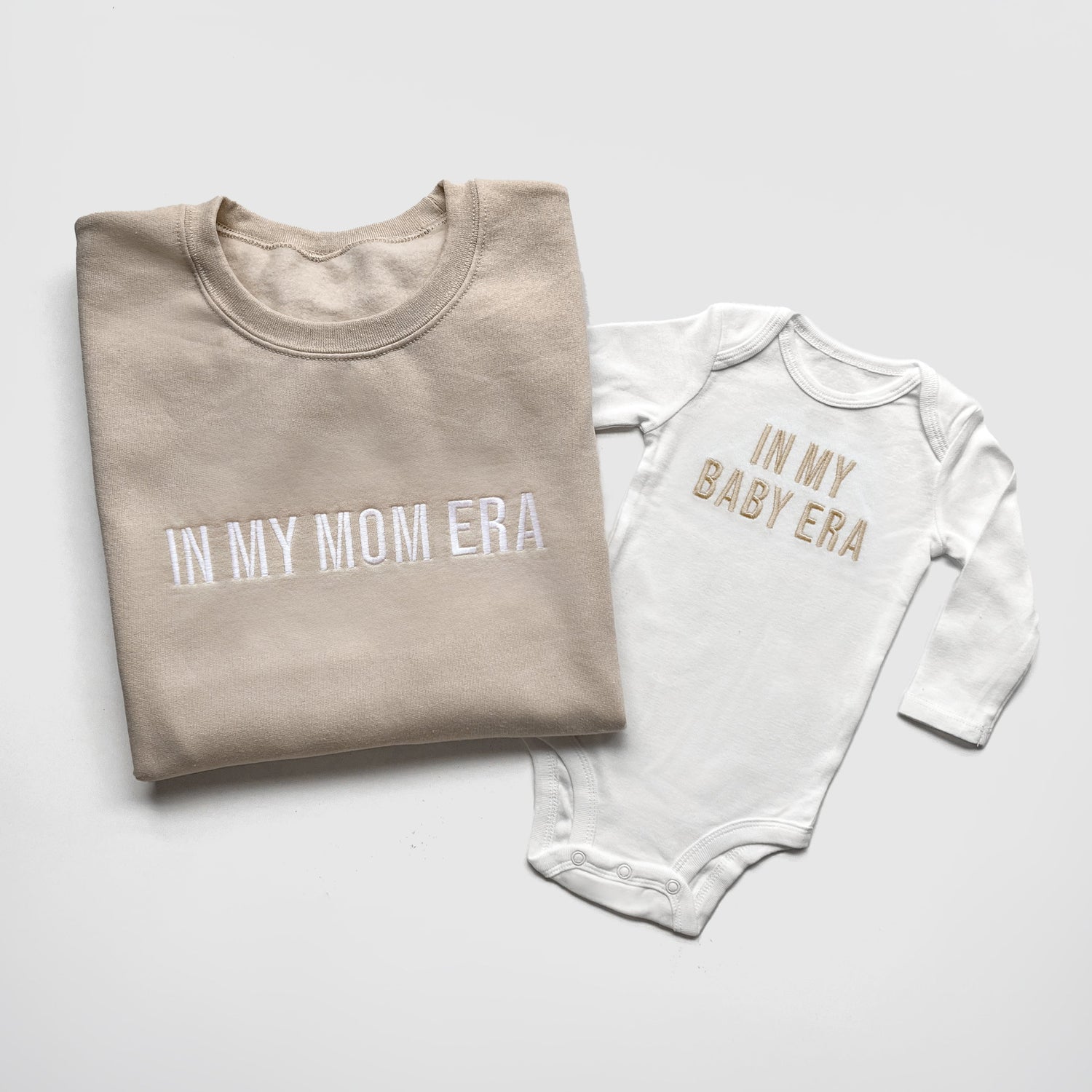 taylor swift in my mom era in my baby era matching baby onesies and sweatshirts crewneck pullover hoodie neutral beige white embroidered embroidery newborn baby shower gift new mom mommy and me mama and mini family matching outfits
