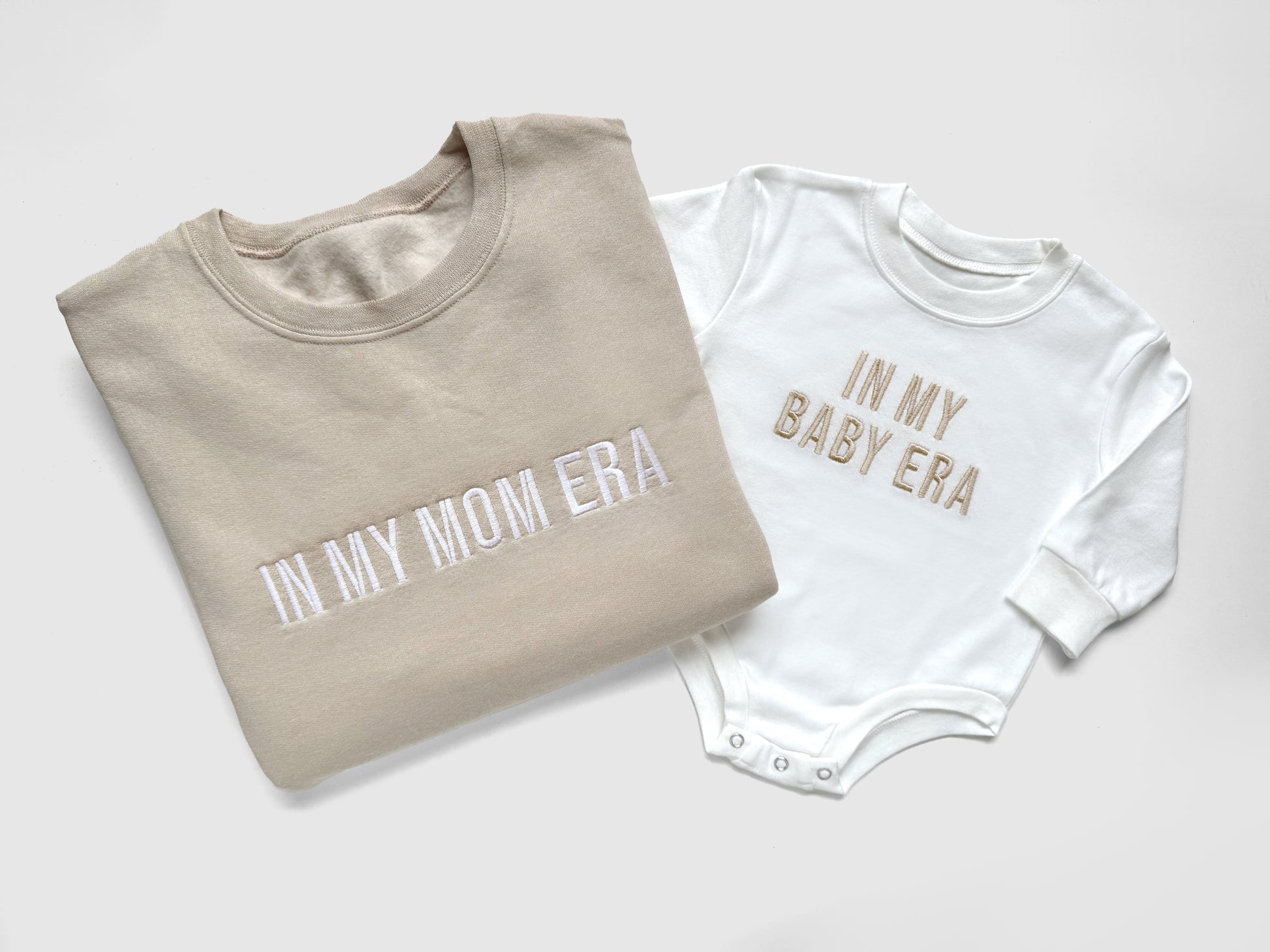 taylor swift in my mom era in my baby era matching baby onesies and sweatshirts crewneck pullover hoodie neutral beige white embroidered embroidery newborn baby shower gift new mom mommy and me mama and mini family matching outfits