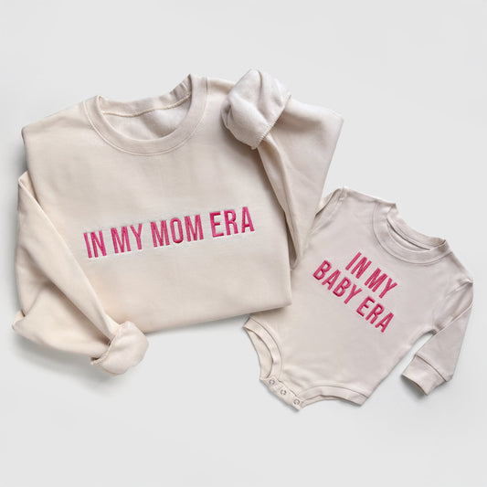 taylor swift in my mom era in my baby era matching baby onesies and sweatshirts crewneck pullover hoodie neutral beige white embroidered embroidery newborn baby shower gift new mom mommy and me mama and mini family matching outfits
