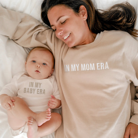 mom and baby matching in my mom era sweatshirts and baby outfits
