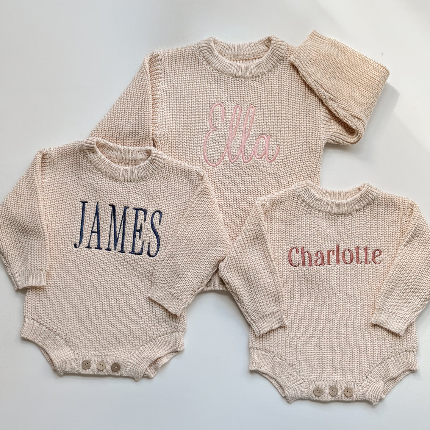Personalized baby sweater rompers with embroidered names in different font styles